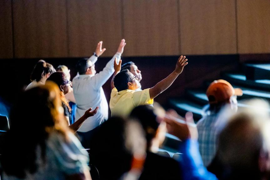 people worshiping inside the building