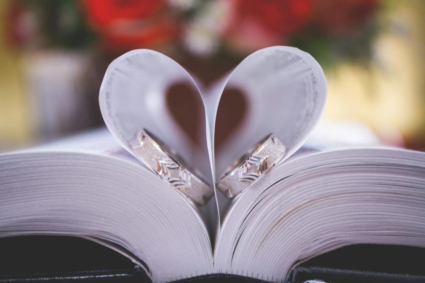two rings on opened book